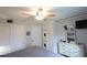 Bedroom with a queen bed, dresser, and in-unit laundry at 5891 Welcome Rd # I6, Bradenton, FL 34207