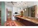 Modern bathroom with double vanity, granite countertops, and large mirror at 601 Weston Pointe Ct, Longboat Key, FL 34228