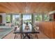 Elegant dining area with modern table and chairs, kitchen view at 601 Weston Pointe Ct, Longboat Key, FL 34228