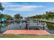 Private dock with boat slips and access to the water at 601 Weston Pointe Ct, Longboat Key, FL 34228