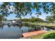 Private dock with boat slips and access to the water at 601 Weston Pointe Ct, Longboat Key, FL 34228