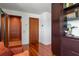 Elegant hallway with an elevator and hardwood floors at 601 Weston Pointe Ct, Longboat Key, FL 34228