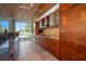 Modern kitchen with granite countertops and wood cabinets at 601 Weston Pointe Ct, Longboat Key, FL 34228