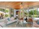 Relaxing living room with glass doors opening to backyard at 601 Weston Pointe Ct, Longboat Key, FL 34228