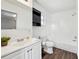 Clean bathroom with shower/tub combo, white vanity, and wood-look floors at 609 10Th E Ave, Bradenton, FL 34208