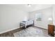 Small bedroom with twin bed, wood floors, and window at 609 10Th E Ave, Bradenton, FL 34208