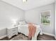 Bright bedroom with a twin bed, plush throw, and window at 609 10Th E Ave, Bradenton, FL 34208