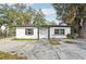 Charming single story home with a well-maintained front yard and driveway at 609 10Th E Ave, Bradenton, FL 34208