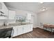 Modern kitchen with white cabinets, granite counters, and stainless steel appliances at 609 10Th E Ave, Bradenton, FL 34208