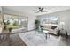 Living room with hardwood floors, glass coffee table, and comfy sofa at 609 10Th E Ave, Bradenton, FL 34208