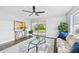 Living room with hardwood floors, glass coffee table, and comfy sofa at 609 10Th E Ave, Bradenton, FL 34208