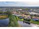 Neighborhood view with lakefront properties and lush greenery at 6150 42Nd Street E Cir, Bradenton, FL 34203