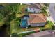 Aerial view of a house with pool and surrounding neighborhood at 6150 42Nd Street E Cir, Bradenton, FL 34203