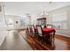 Formal dining room with hardwood floors and a red tablecloth at 6150 42Nd Street E Cir, Bradenton, FL 34203