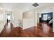 Hardwood floor hallway with doors to bedrooms at 6150 42Nd Street E Cir, Bradenton, FL 34203