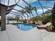 Inviting screened pool and patio area with lounge chairs at 6150 42Nd Street E Cir, Bradenton, FL 34203