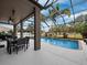 Large screened pool with patio and outdoor dining at 6150 42Nd Street E Cir, Bradenton, FL 34203