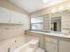 Bathroom features a bathtub and updated vanity at 62 Pelican S Dr, Oldsmar, FL 34677