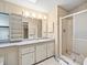 Bathroom with shower, vanity, and tiled floors at 62 Pelican S Dr, Oldsmar, FL 34677