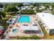 Aerial view of community pool, spa, and clubhouse at 62 Pelican S Dr, Oldsmar, FL 34677