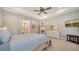 Bright bedroom with a dresser and TV at 7087 Tamworth Pkwy, Sarasota, FL 34241