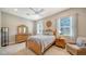 Cozy bedroom with a comfortable bed and seating area at 7087 Tamworth Pkwy, Sarasota, FL 34241