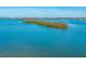 Wide shot of water, land, and city in distance at 716 Tropical Cir, Sarasota, FL 34242