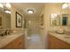 Bathroom with double vanity and bathtub at 716 Tropical Cir, Sarasota, FL 34242