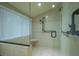 Walk-in shower with built-in seat and grab bars at 716 Tropical Cir, Sarasota, FL 34242