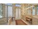 Elegant bathroom with double vanities and glass block windows at 7349 Windemere Ln, University Park, FL 34201