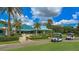 The Varsity Club exterior features a teal roof, striped awning, and lush landscaping at 7349 Windemere Ln, University Park, FL 34201