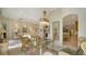 Bright dining area with glass-top table and built-in shelving at 7349 Windemere Ln, University Park, FL 34201