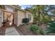 Side view of the house with a walkway leading to the entryway at 7349 Windemere Ln, University Park, FL 34201