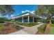 Community fitness center with teal roof and landscaping at 7349 Windemere Ln, University Park, FL 34201