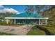 Community fitness center with teal roof and landscaping at 7349 Windemere Ln, University Park, FL 34201