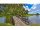 Wooden bridge over water feature on a golf course at 7349 Windemere Ln, University Park, FL 34201