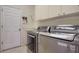 Laundry room with washer, dryer, and a sink at 7349 Windemere Ln, University Park, FL 34201