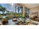 Relaxing screened porch overlooking a peaceful lake at 7349 Windemere Ln, University Park, FL 34201