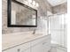 Bathroom with vanity, large mirror and a shower at 7432 39Th E Ct, Sarasota, FL 34243