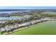 Aerial view of the community and surrounding area at 7876 Grande Shores Dr, Sarasota, FL 34240