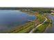 Aerial view of waterfront community with walking paths and lake access at 7876 Grande Shores Dr, Sarasota, FL 34240