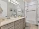 Elegant bathroom with double vanity and a relaxing bathtub at 7876 Grande Shores Dr, Sarasota, FL 34240