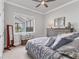 Guest bedroom with a queen-size bed and plenty of natural light at 7876 Grande Shores Dr, Sarasota, FL 34240