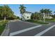 Gated community entrance with signage and landscaping at 7876 Grande Shores Dr, Sarasota, FL 34240