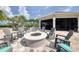 Community fire pit with surrounding seating at 7876 Grande Shores Dr, Sarasota, FL 34240