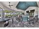 Indoor bar area with seating and a view of the pool at 7876 Grande Shores Dr, Sarasota, FL 34240