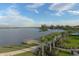 Peaceful lake view with a dock and walking path at 7876 Grande Shores Dr, Sarasota, FL 34240