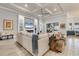 Living room with sectional sofa, built-in fireplace, and built-in shelving at 7876 Grande Shores Dr, Sarasota, FL 34240