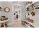 Organized mudroom with bench seating, cubbies, and hooks at 7876 Grande Shores Dr, Sarasota, FL 34240