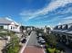 Aerial view of a charming town square with shops and parked cars at 7876 Grande Shores Dr, Sarasota, FL 34240